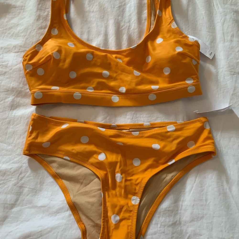NWT 2 piece swimsuit.  Size M top and S bottom. Sunny yellow polka dot.